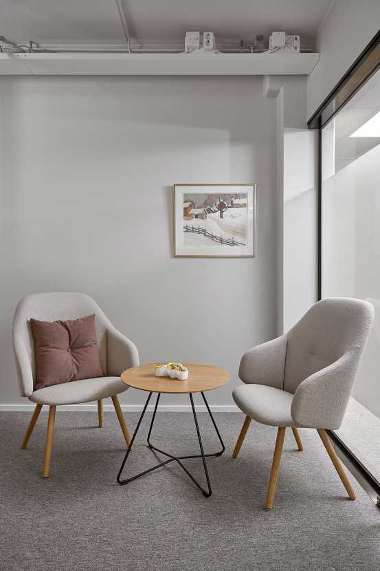 Sola soft armchairs and Scoop table
