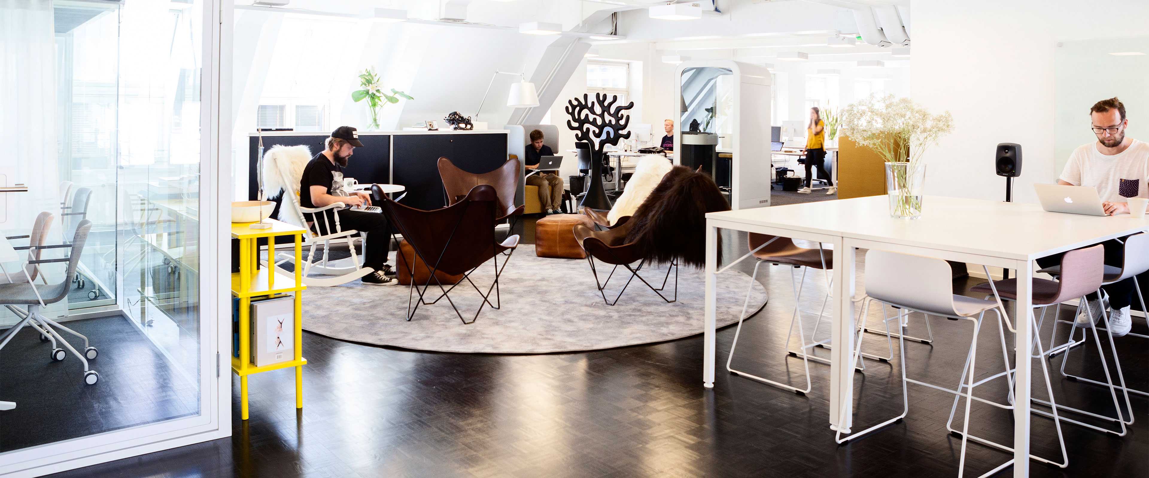 SFB Agency and DQ Communication's employees working at Martela's Sola chairs and Alku tables